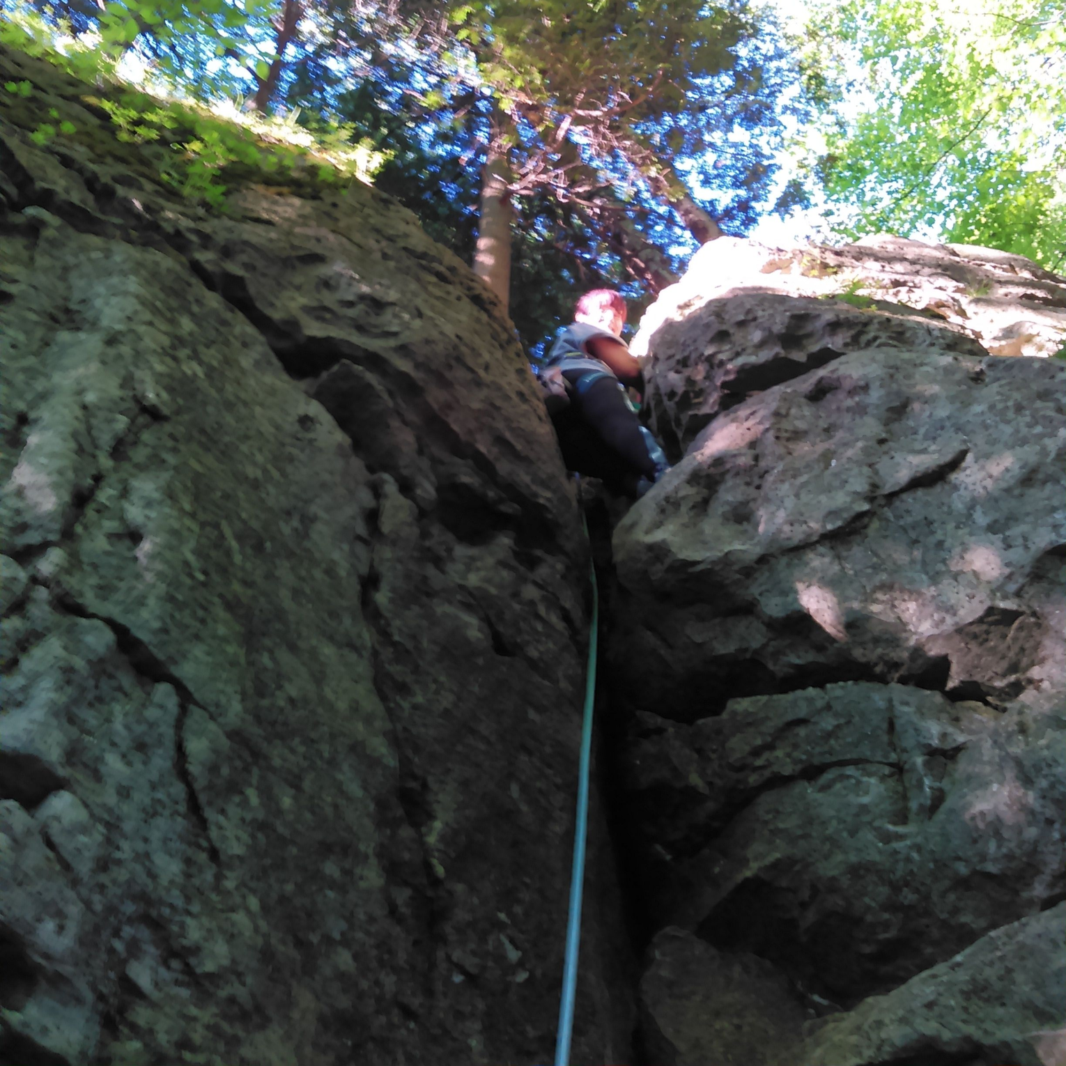 Johanna LeRoux at the top of her first rock climb in full falls safety equipment.