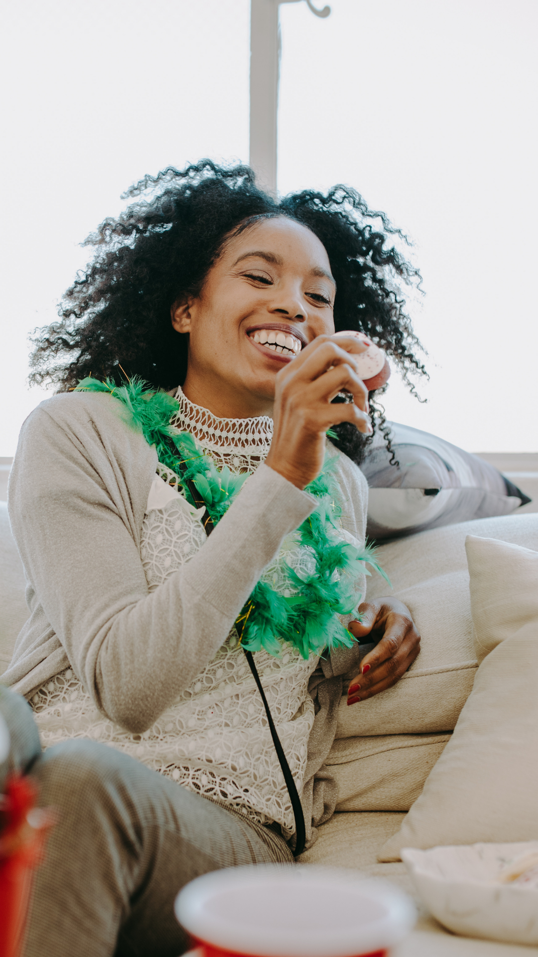 Black woman laughing joyfully while organizing a fun moment—embodying ease, clarity, and balance through intentional life ops and project planning.