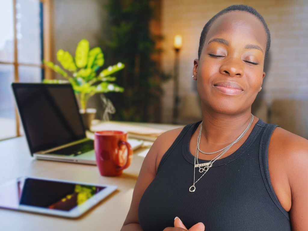 Black woman in soft girl era energy, eyes closed in peace at her desk — embodying the transformation mindset and lifestyle coaching brings for ambitious Black women, corporate baddies, and boss babes ready to enjoy life, not just work hard.