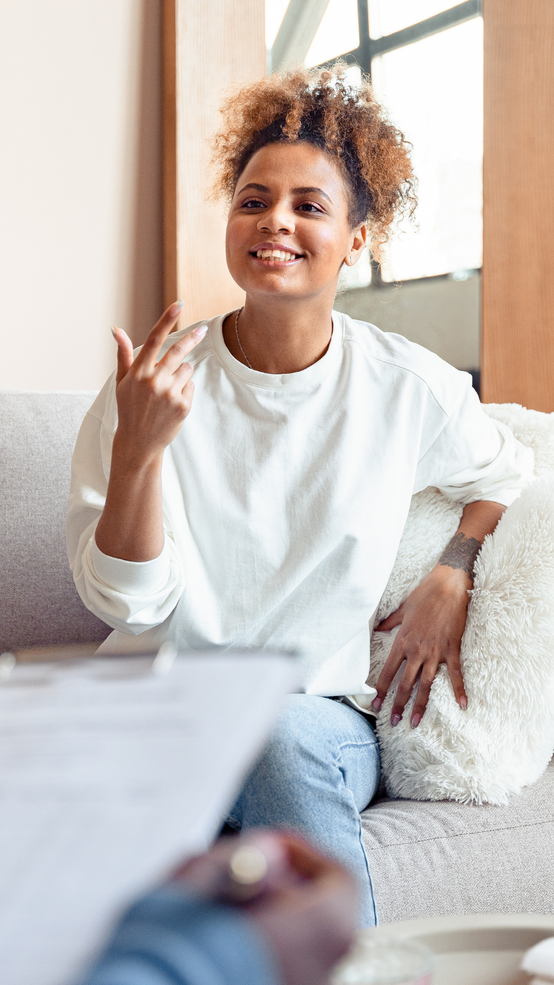 Black woman smiling and speaking with a coach during a virtual lifestyle audit—burnout clarity session for high-achieving women seeking rest-centered support
