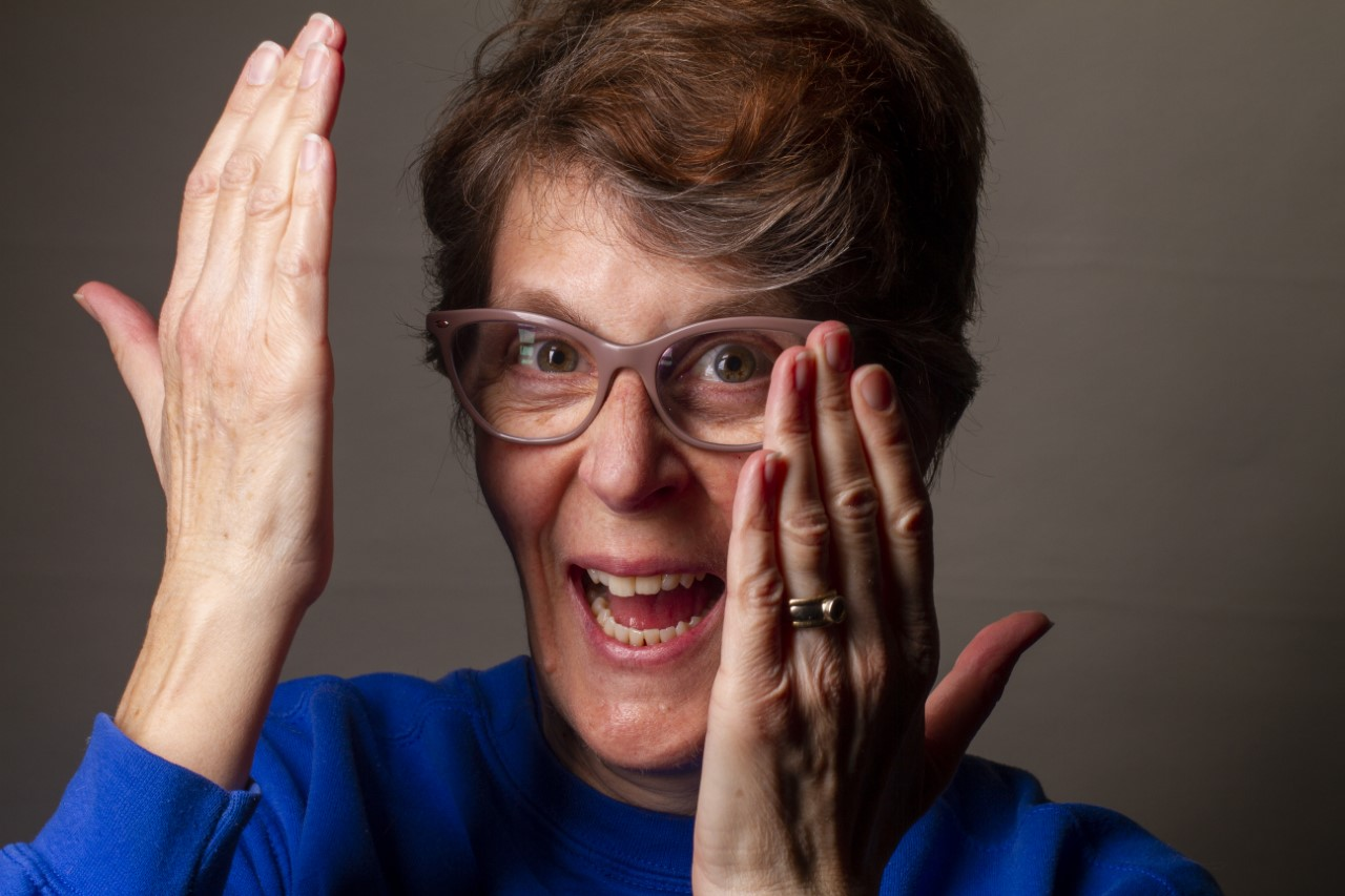 Picture of Cherylynne Crowther, middle-aged white woman with brown hair, glasses and wearing a blue shirt. 