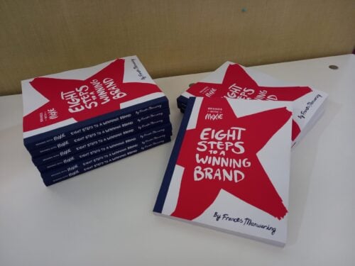 Stack of books — Brands with Moxie Eight Steps to a Winning Brand by Frances Manwaring
