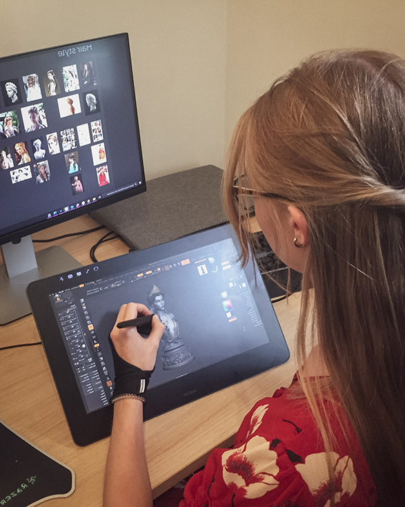 An artist creating a digital chess piece
