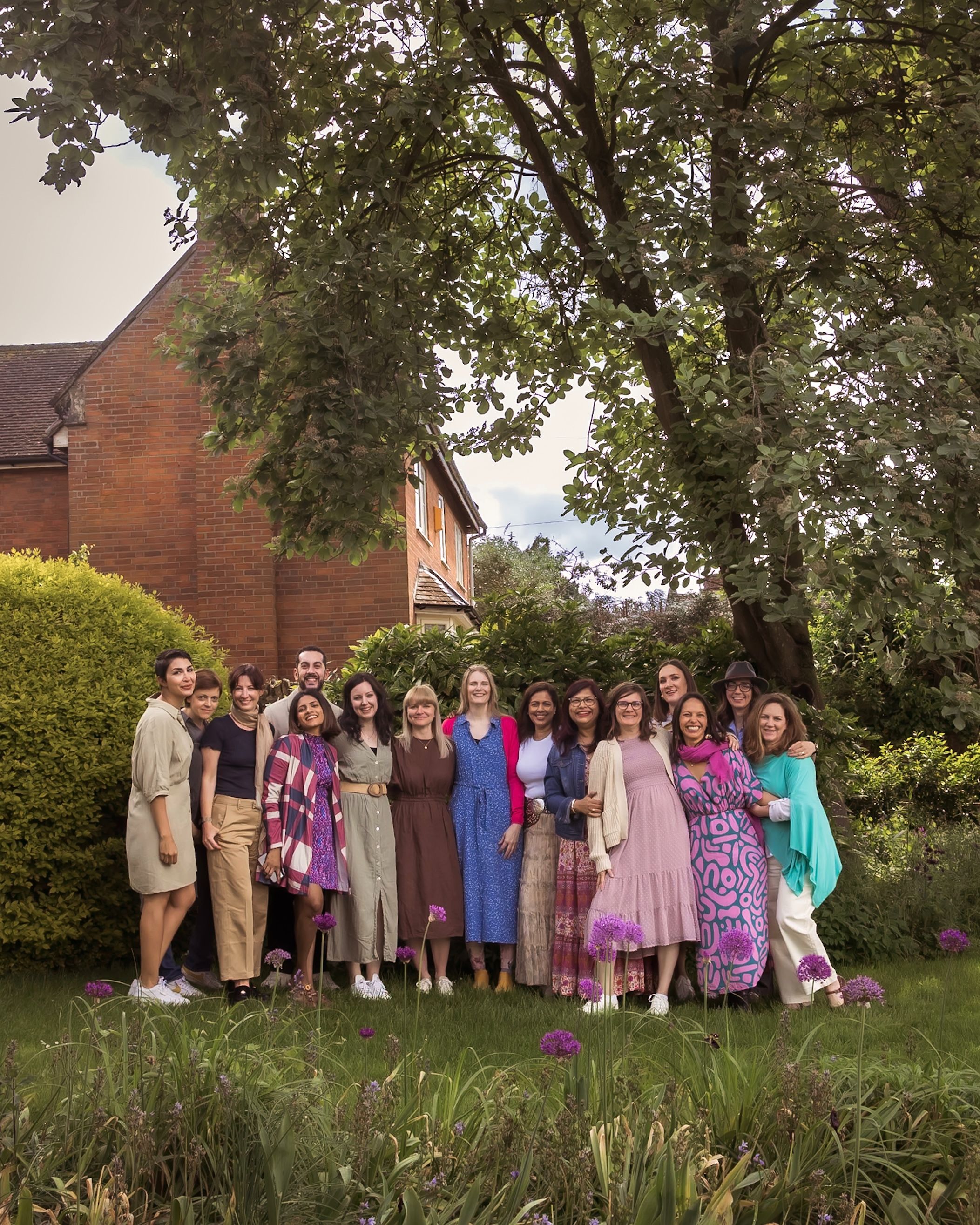 Cotswolds group of food photographers in colorful dresses at spring retreat by Seema Rose