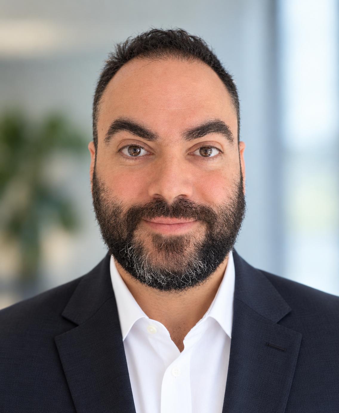 A profile photo of Dan Tahmassebi, the director of TaxReady.