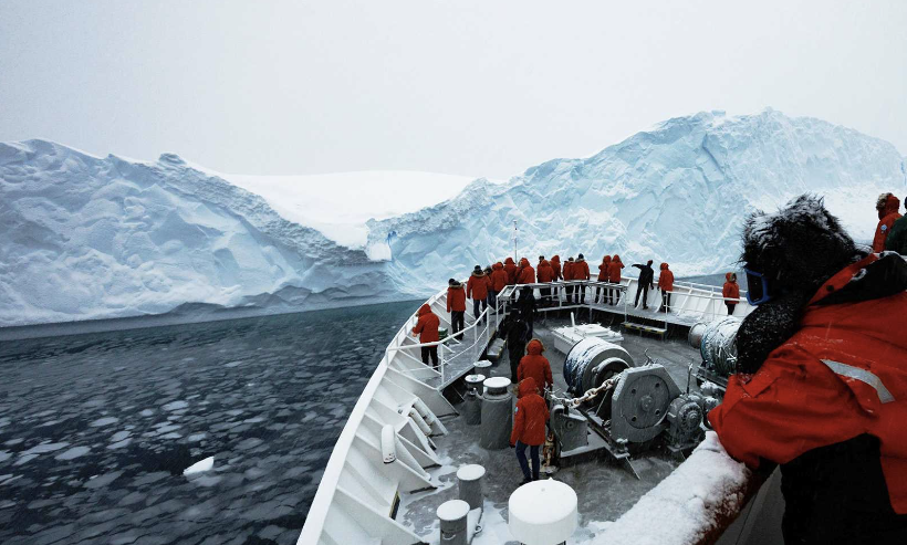 image of explorers on a boat in Antarctica