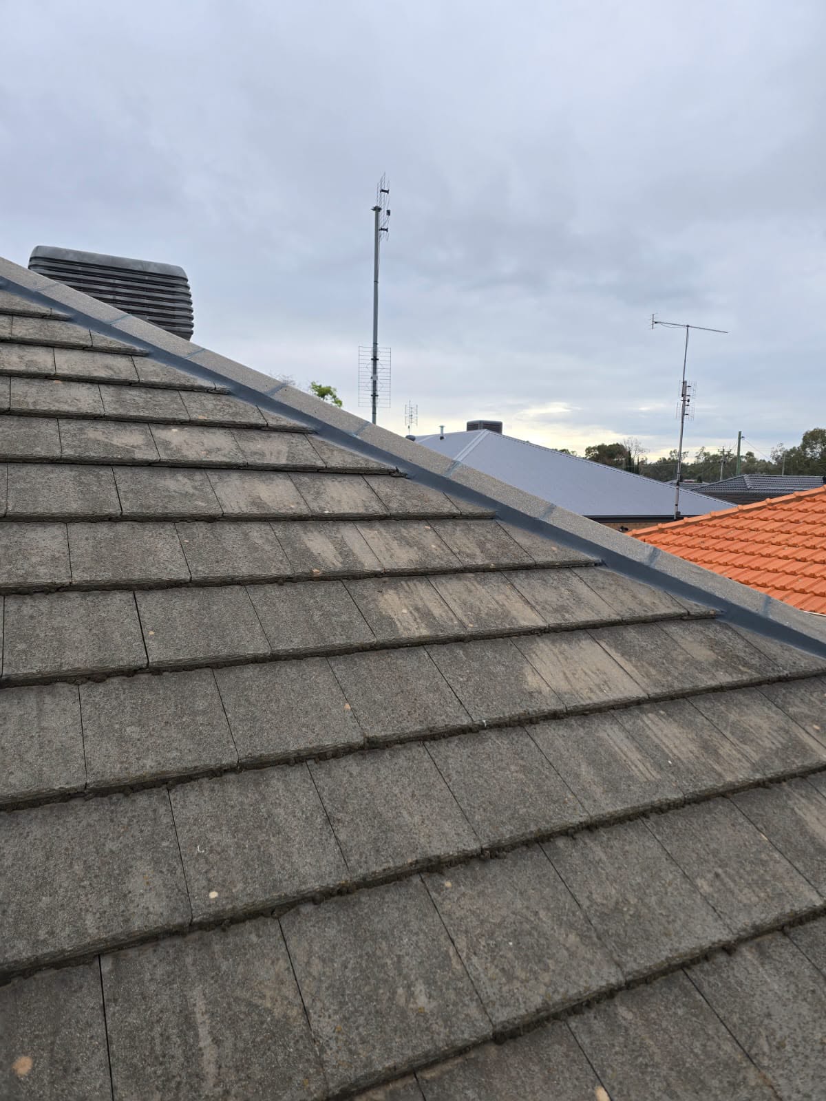 Freshly finished tiled roof with straight ridge lines