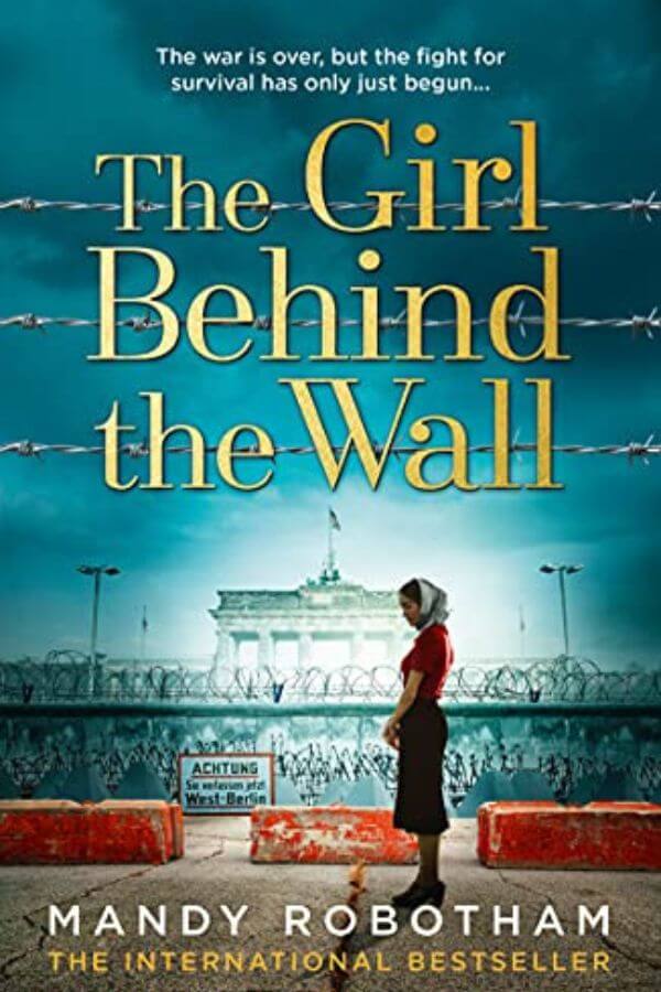 Book cover for The Girl Behind The Wall by Mandy Robotham