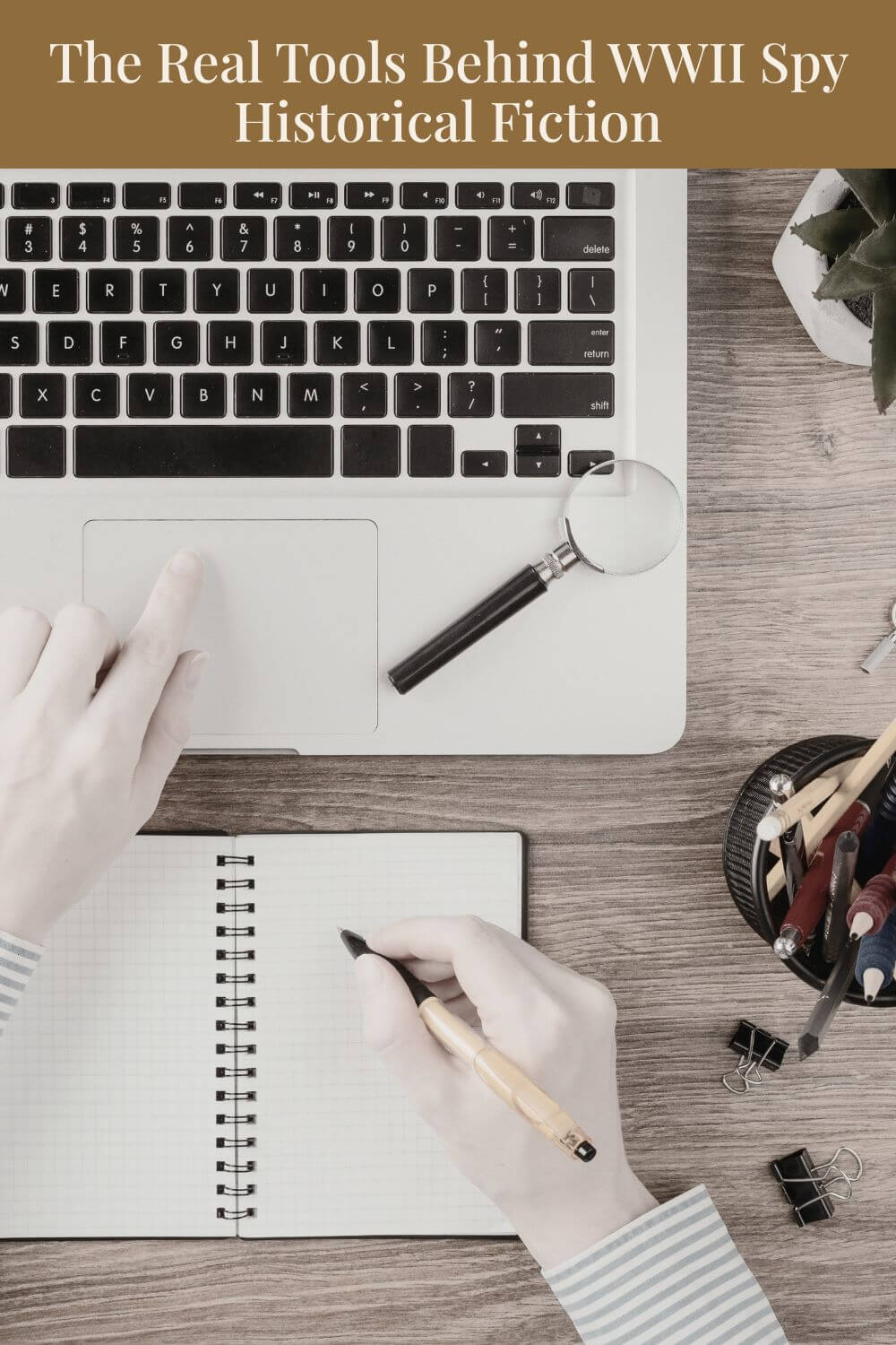 Person writing in a notebook beside a laptop with a magnifying glass on the keyboard. Title above reads, “The Real Tools Behind WWII Spy Historical Fiction.”