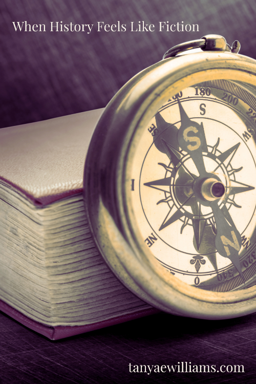 Closed vintage book and a compass