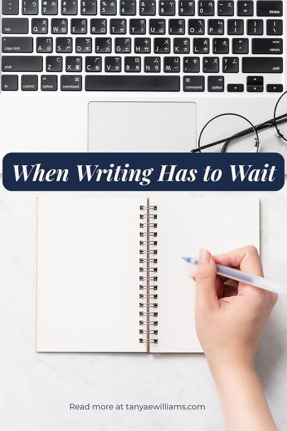 A top view of a laptop keyboard, an open notebook, and a hand holding a pen, conveying paused writing. Text overlay reads, 