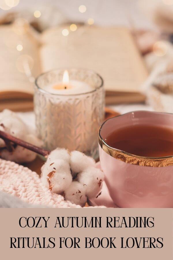 Warm autumn vibes with a burning candle, cup of tea, soft blanket and twinkle lights. Text: "Cozy autumn reading rituals for book lovers"