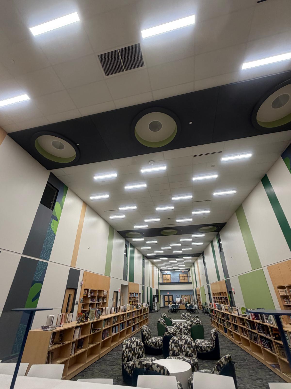 Completed library learning space with bookshelves and seating area