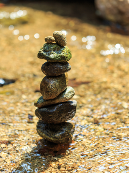 stacked rocks in a river