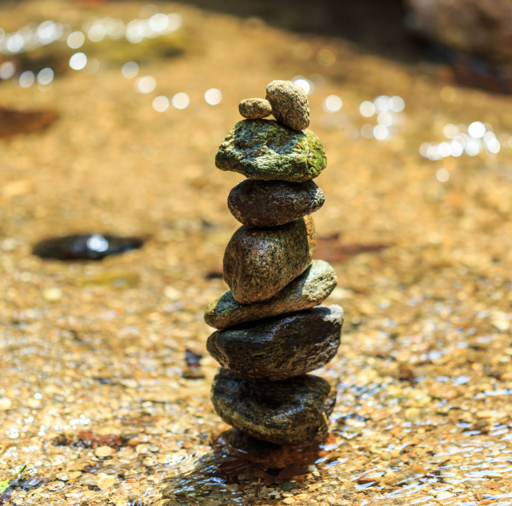 Stacked stones in river.