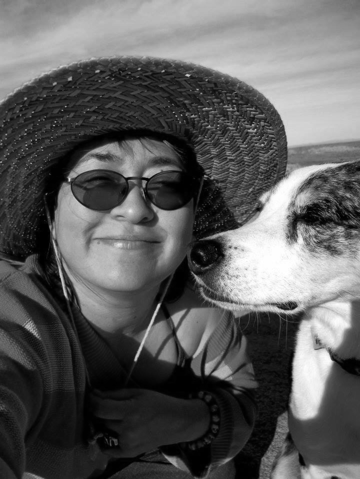 Pogo Saito with her dog, smiling at you.