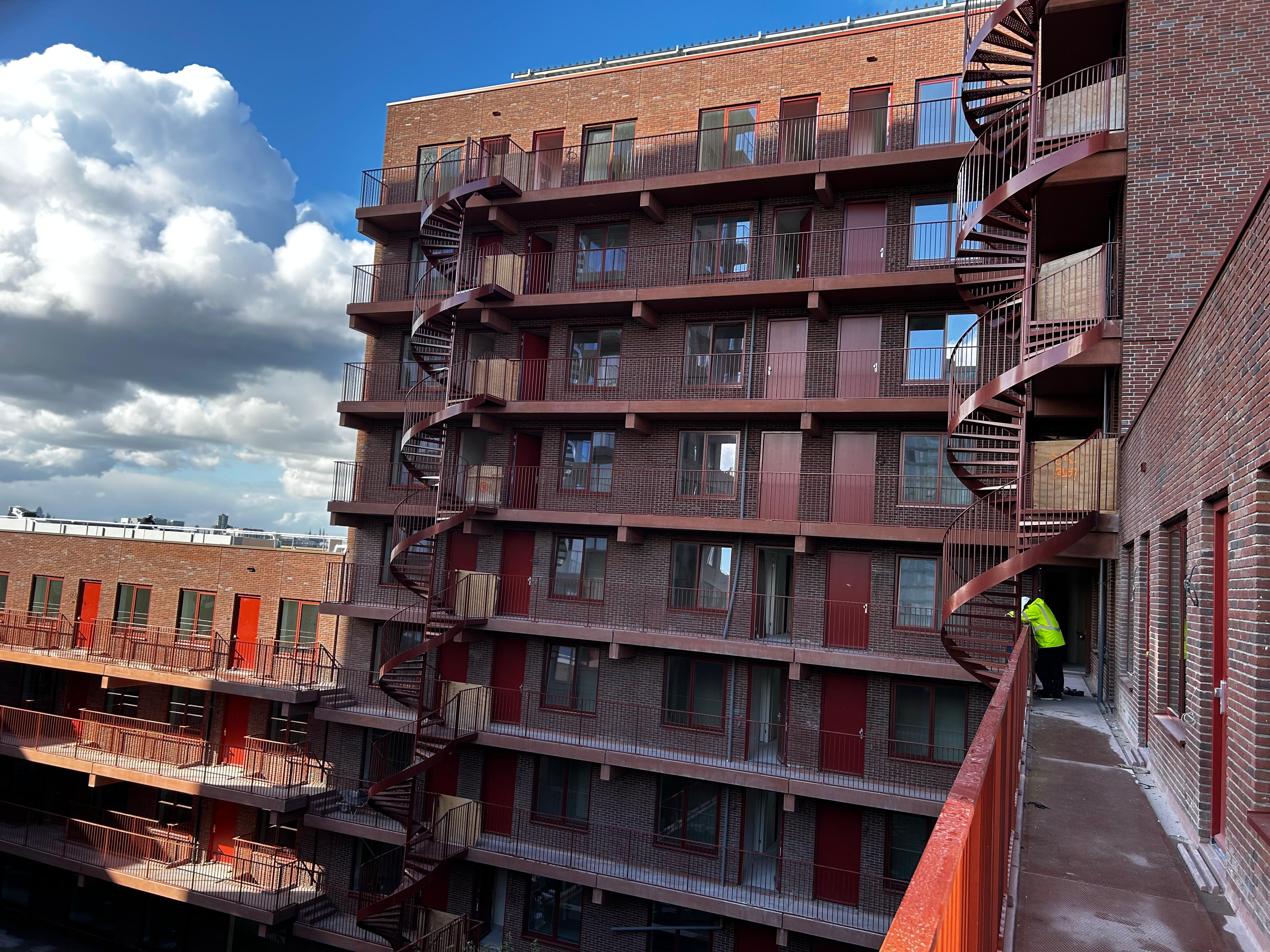 Windows, doors, railing and starcase construction in a new apartmentcomplex