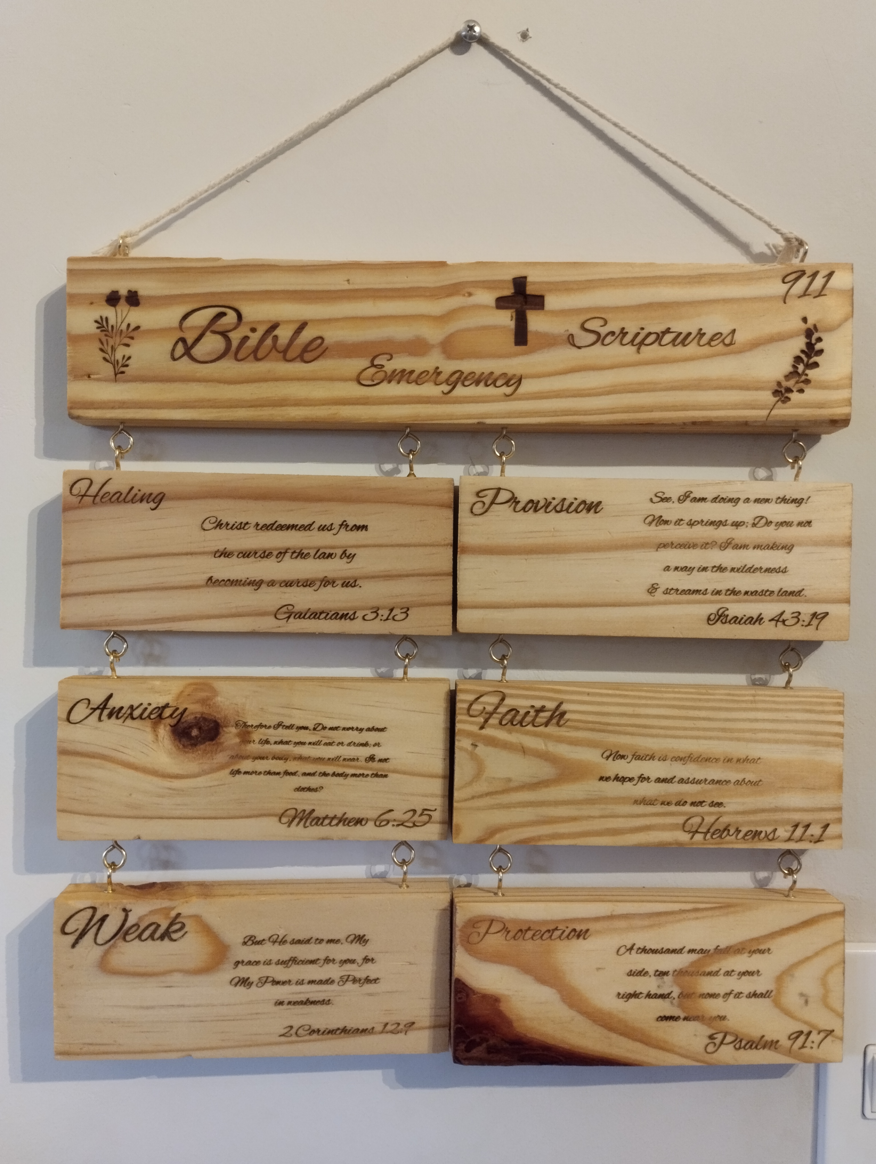 Handmade wooden wall art with seven blocks, six engraved with Bible scriptures and top block reading ‘Bible Emergency Scriptures’, Christian home décor