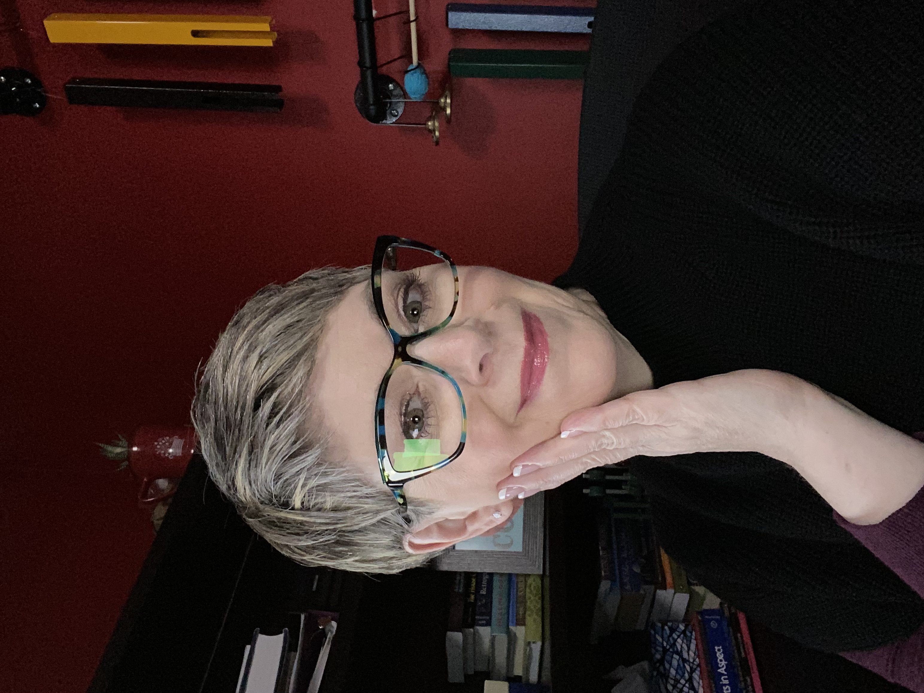 Image of Canadian Astrologer Tracy Quinlan at home in her office.