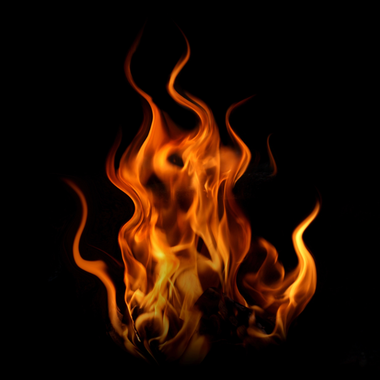 A vivid orange flame with curling tendrils rising against a black background