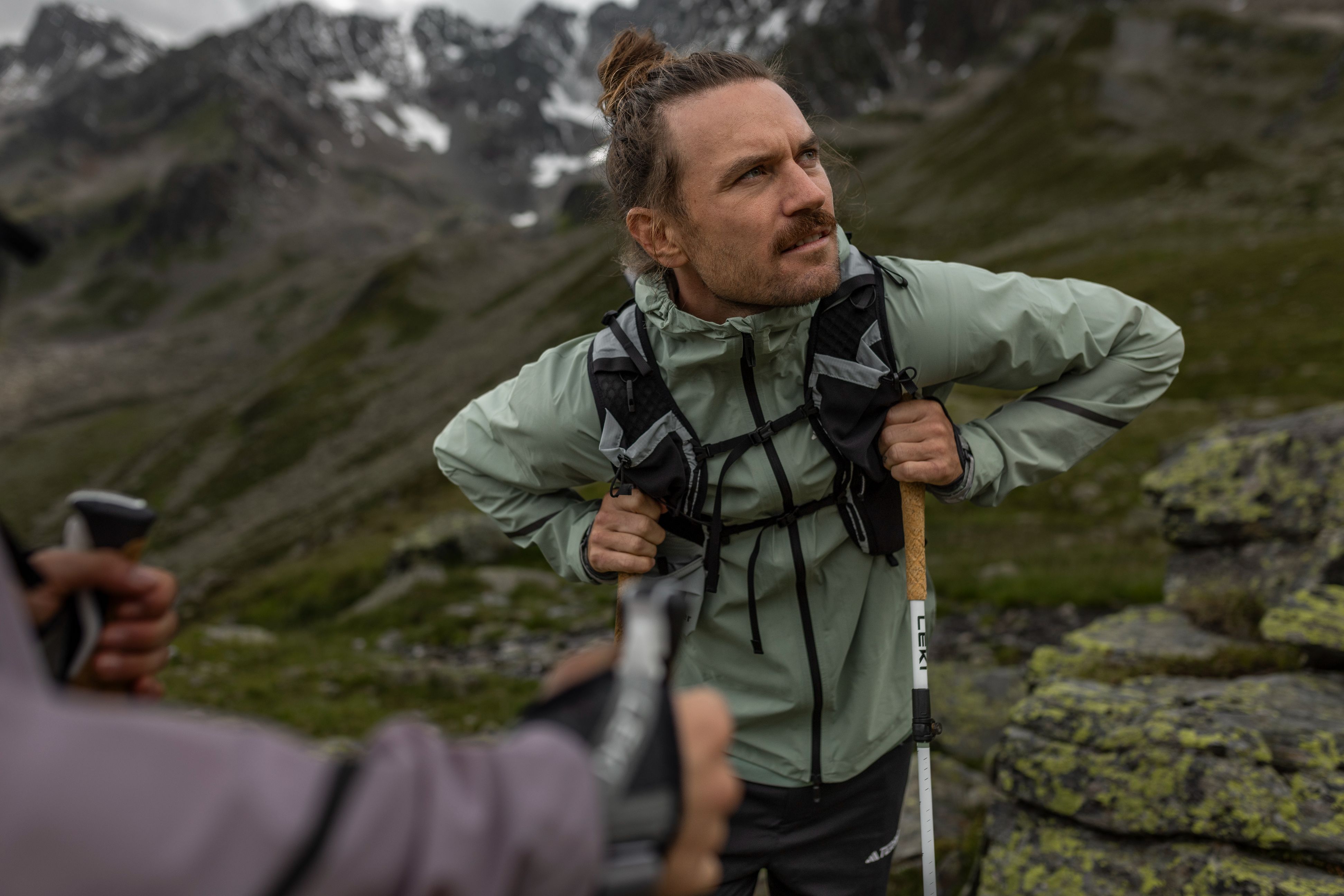 LEKI walking poles providing stability on a mountain trail