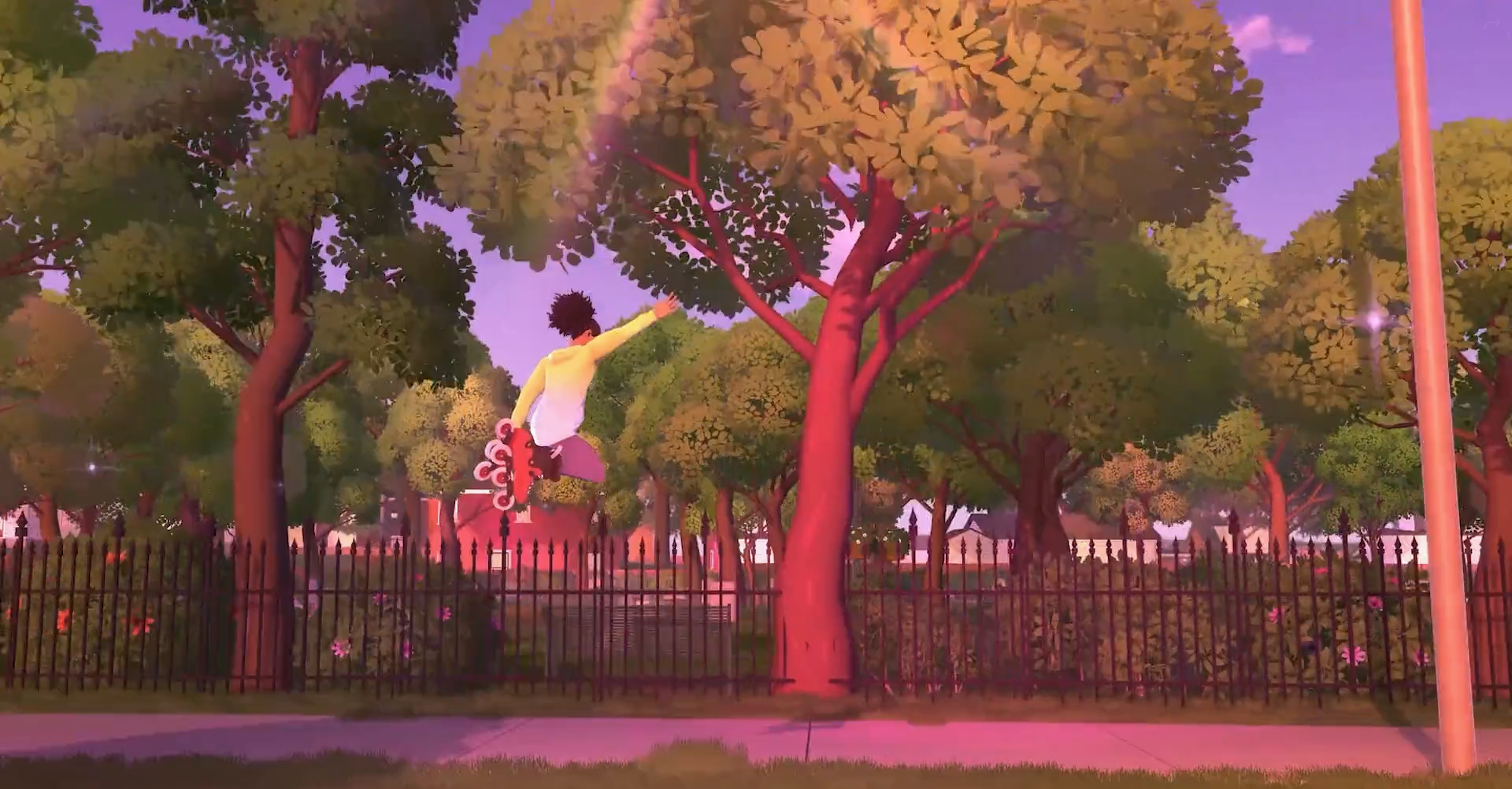 a girl in rollerblades, jumping on a sidewalk in front of a background of trees and blue sky.