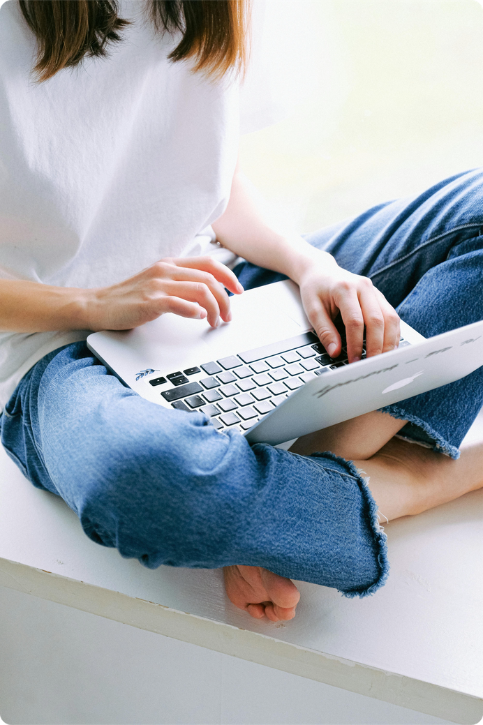Freelancer working on email marketing strategy using a laptop at home