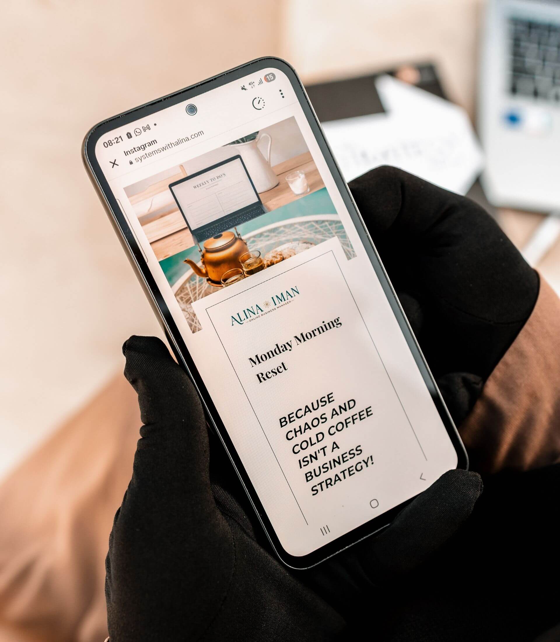 image of phone held in two hands with the Monday Morning Reset newsletter on screen