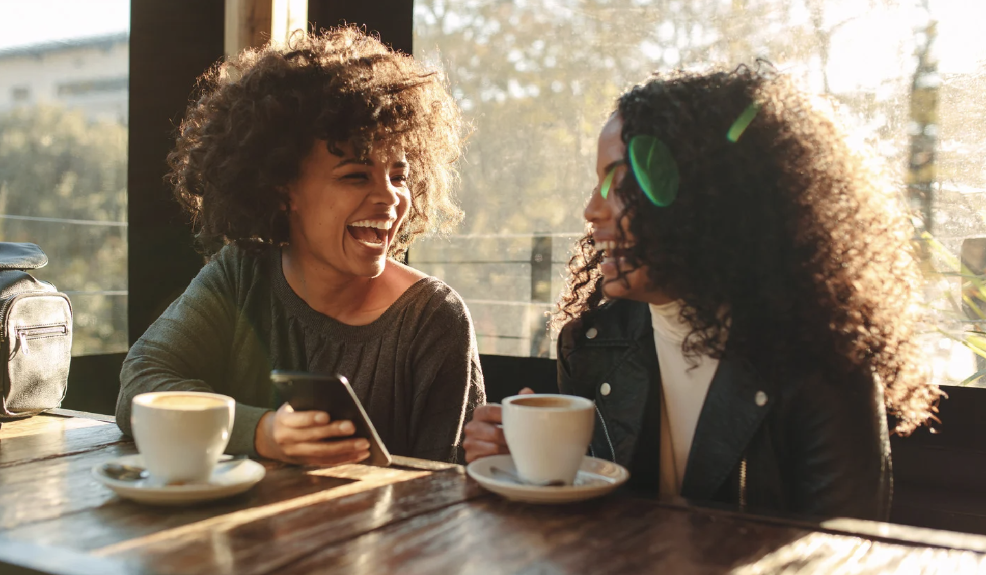 having joy as a leader with confidence, women laughing at table