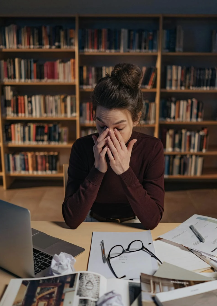 woman working and feeling burnt out and wanting to overcome burnout