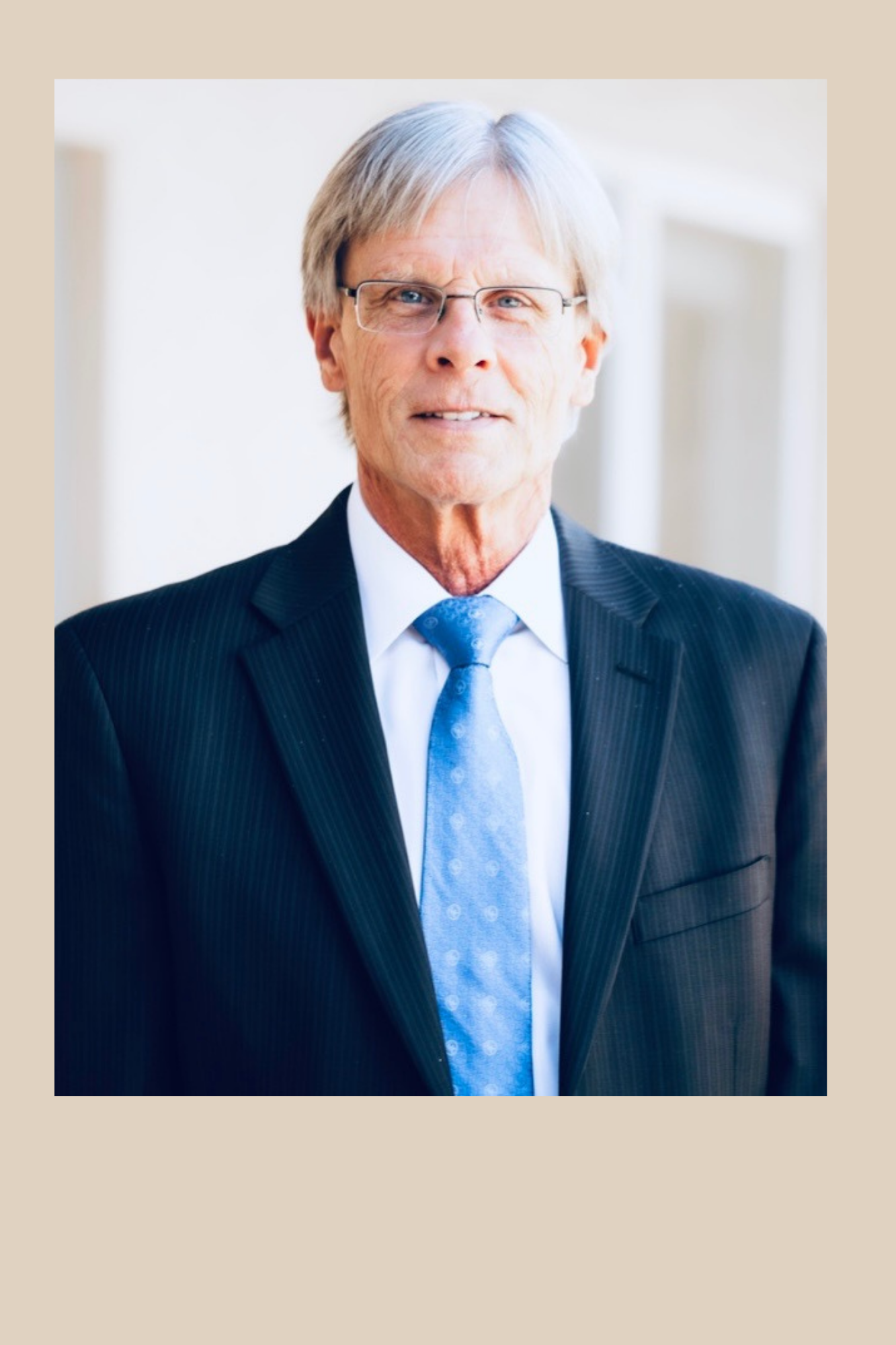 Headshot of Rick Fredrickson. He is an middle aged man with grey hair and glasses.