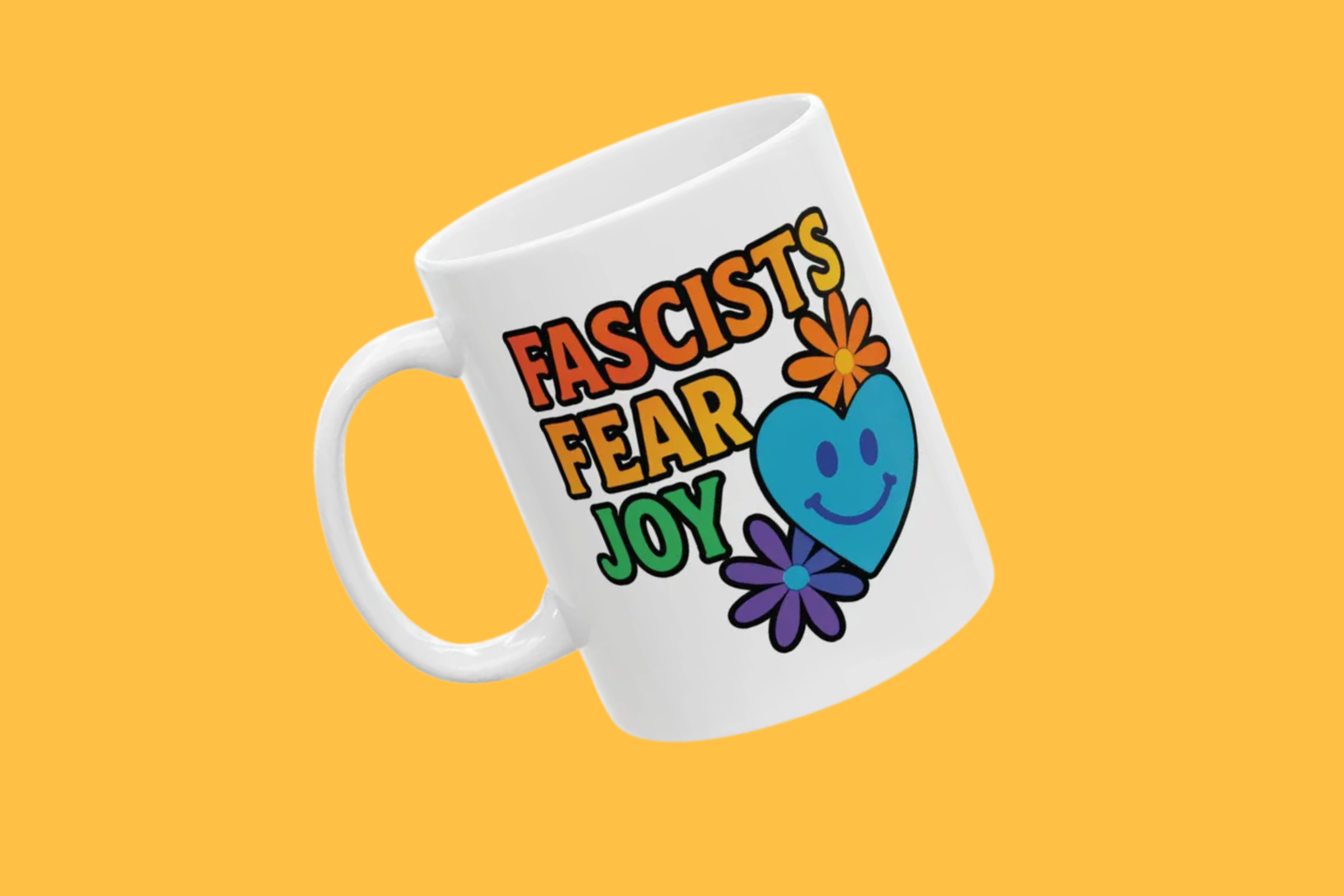 white ceramic mug with colorful design that says Fascists fear joy