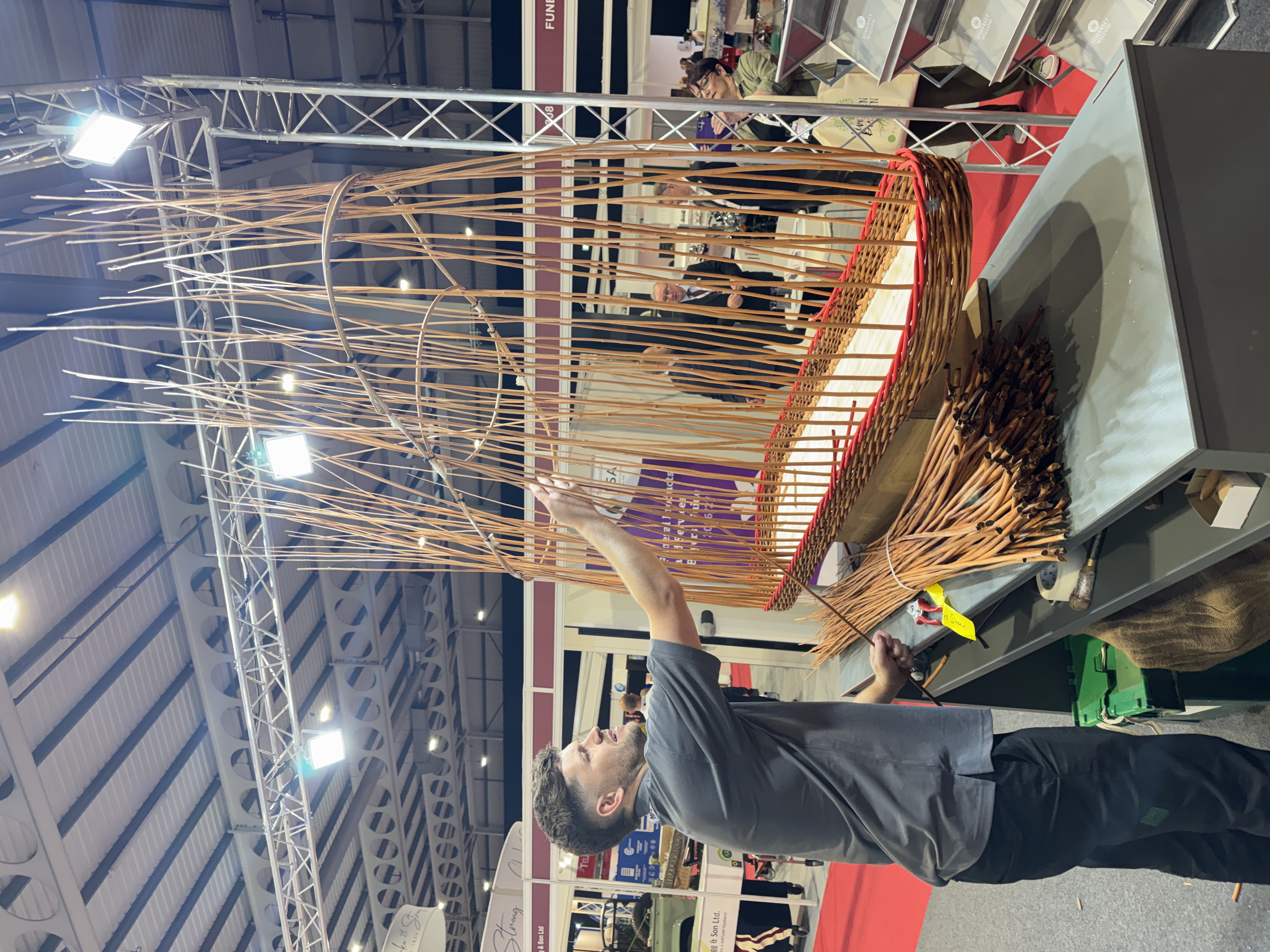 Wicker coffin being hand-woven at National Funeral Exhibition - funeral options