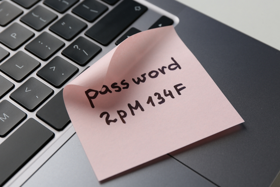 Password written on sticky note next to laptop - why you need a digital legacy plan