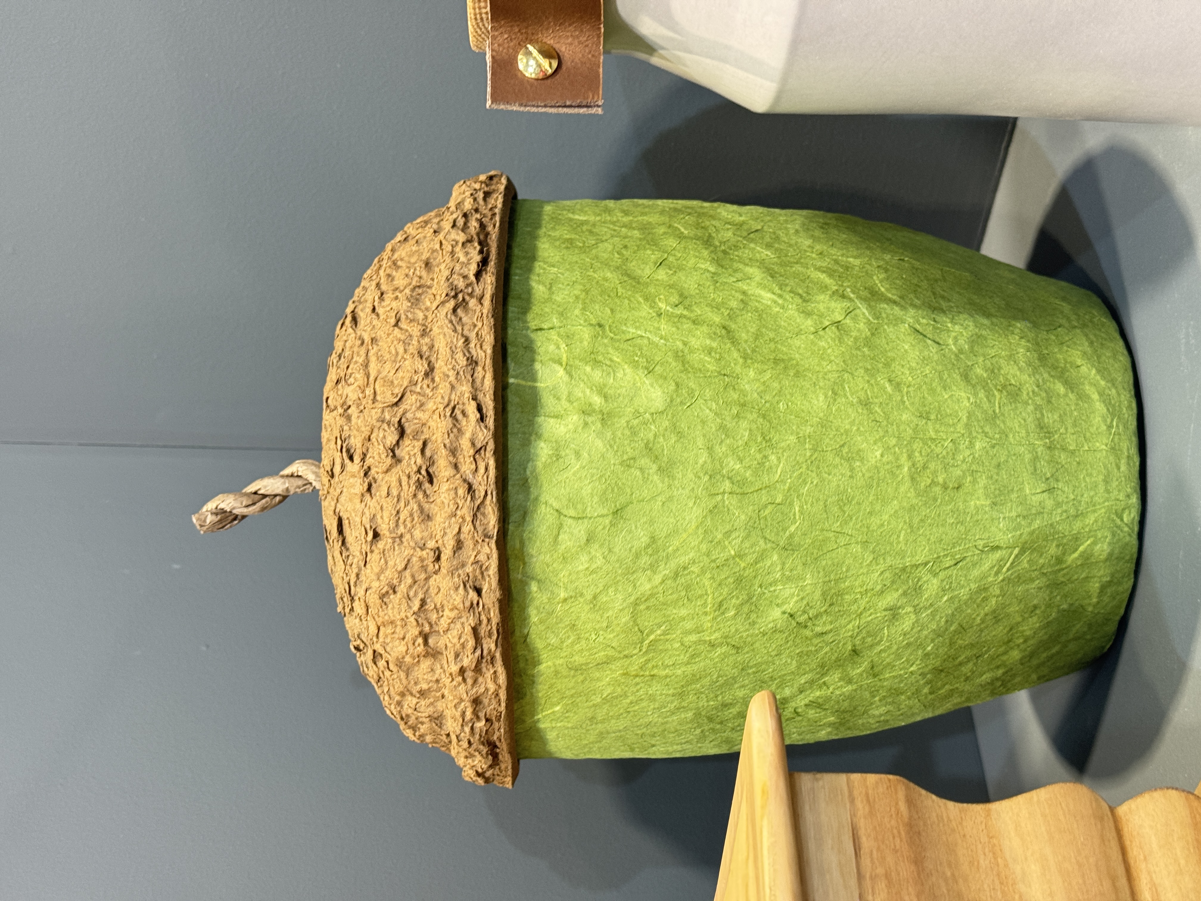 Green biodegradable acorn urn at National Funeral Exhibition - eco friendly funeral options
