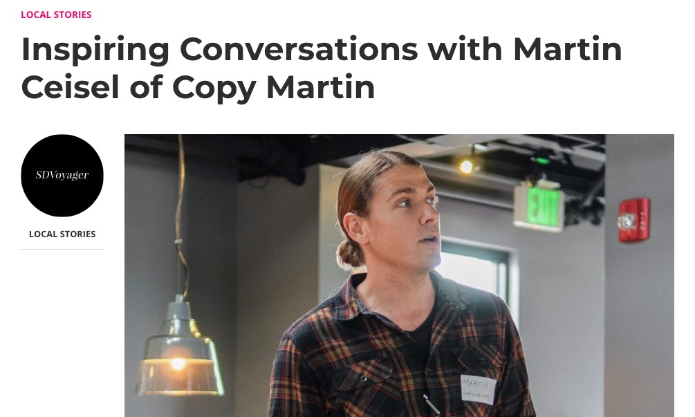 Screenshot of an SD Voyager interview feature with the headline 'Inspiring Conversations with Martin Ceisel of Copy Martin' above a photograph of Martin Ceisel. In the image, Martin has long hair pulled back and is wearing a plaid shirt with a name tag, looking engaged while speaking. The SD Voyager logo and 'LOCAL STORIES' label appear on the left side of the image.
