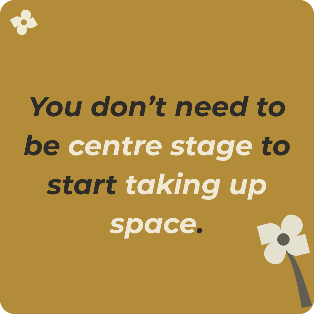 Farhana Aboo in a coaching conversation with a client, sitting at a desk in a relaxed, informal setting