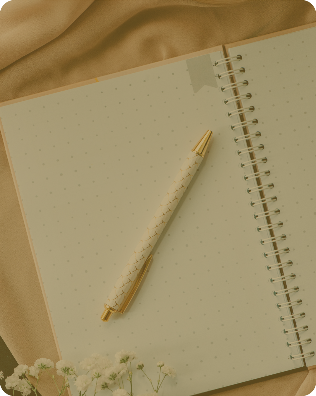 An open journal and pen on a table, representing reflection, clarity and personal insight through coaching.