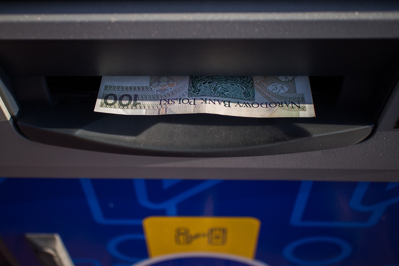 Cash being dispensed from an ATM