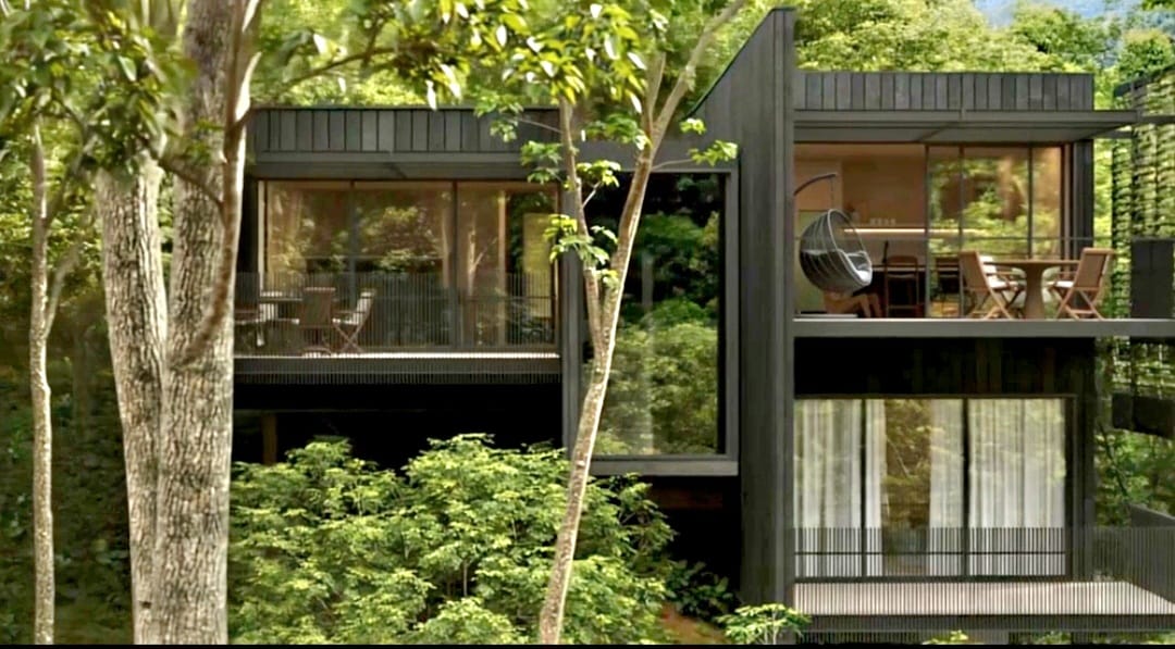Residence façade within lush trees
