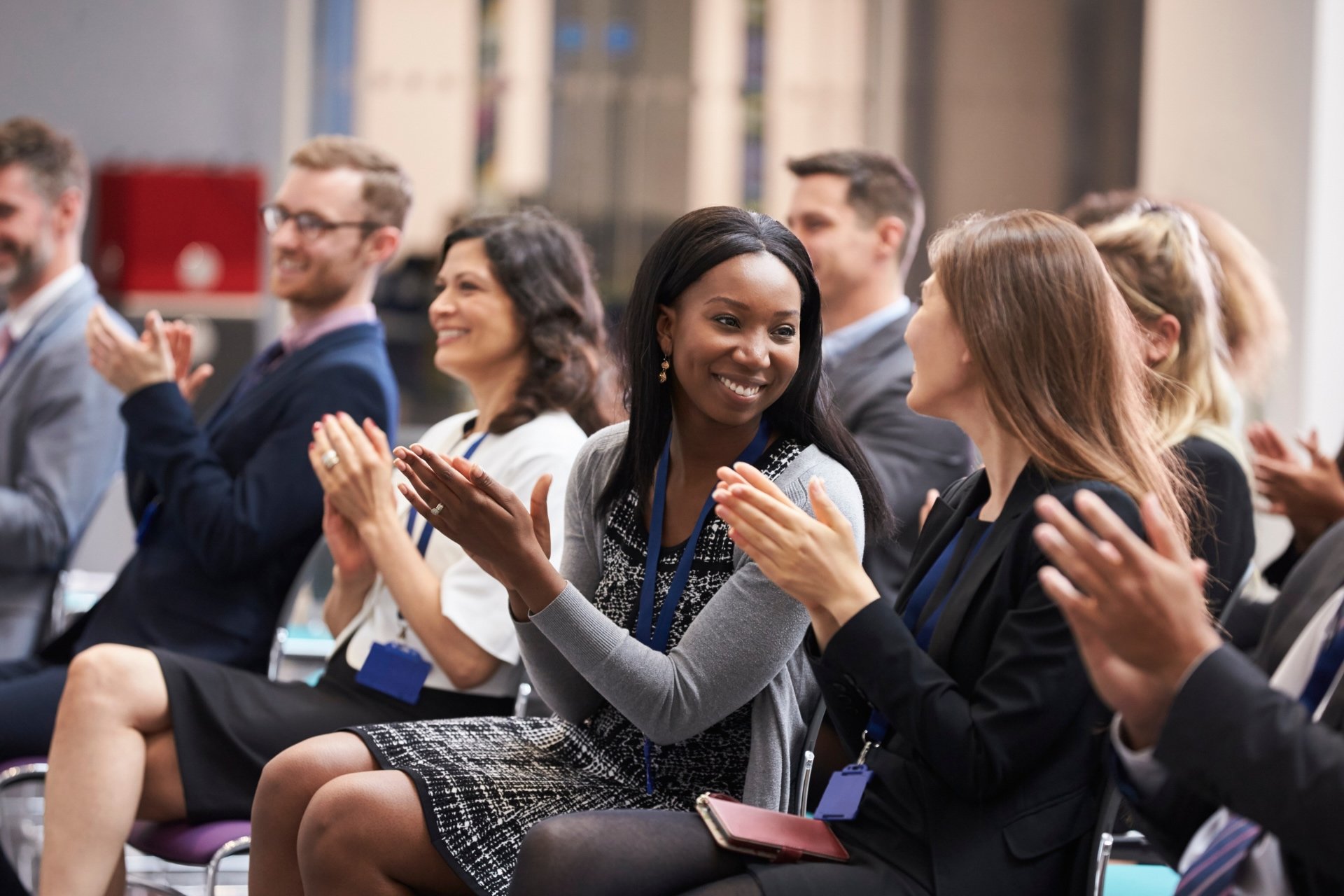 School faculty applaud an exciting announcement during an after-school faculty meeting.