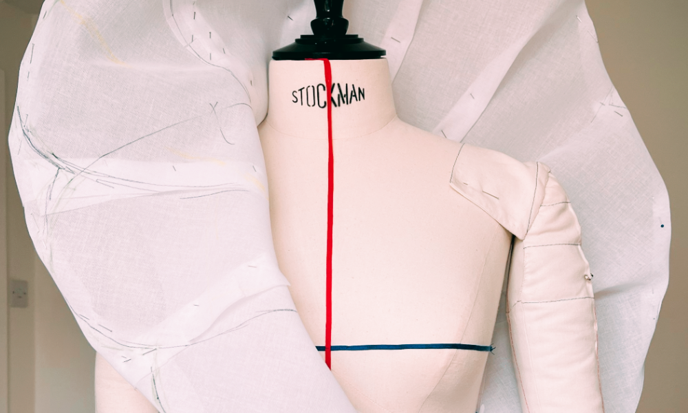 Creative pattern cutting in progress – studio view-Muslin prototype on dress form – couture draping