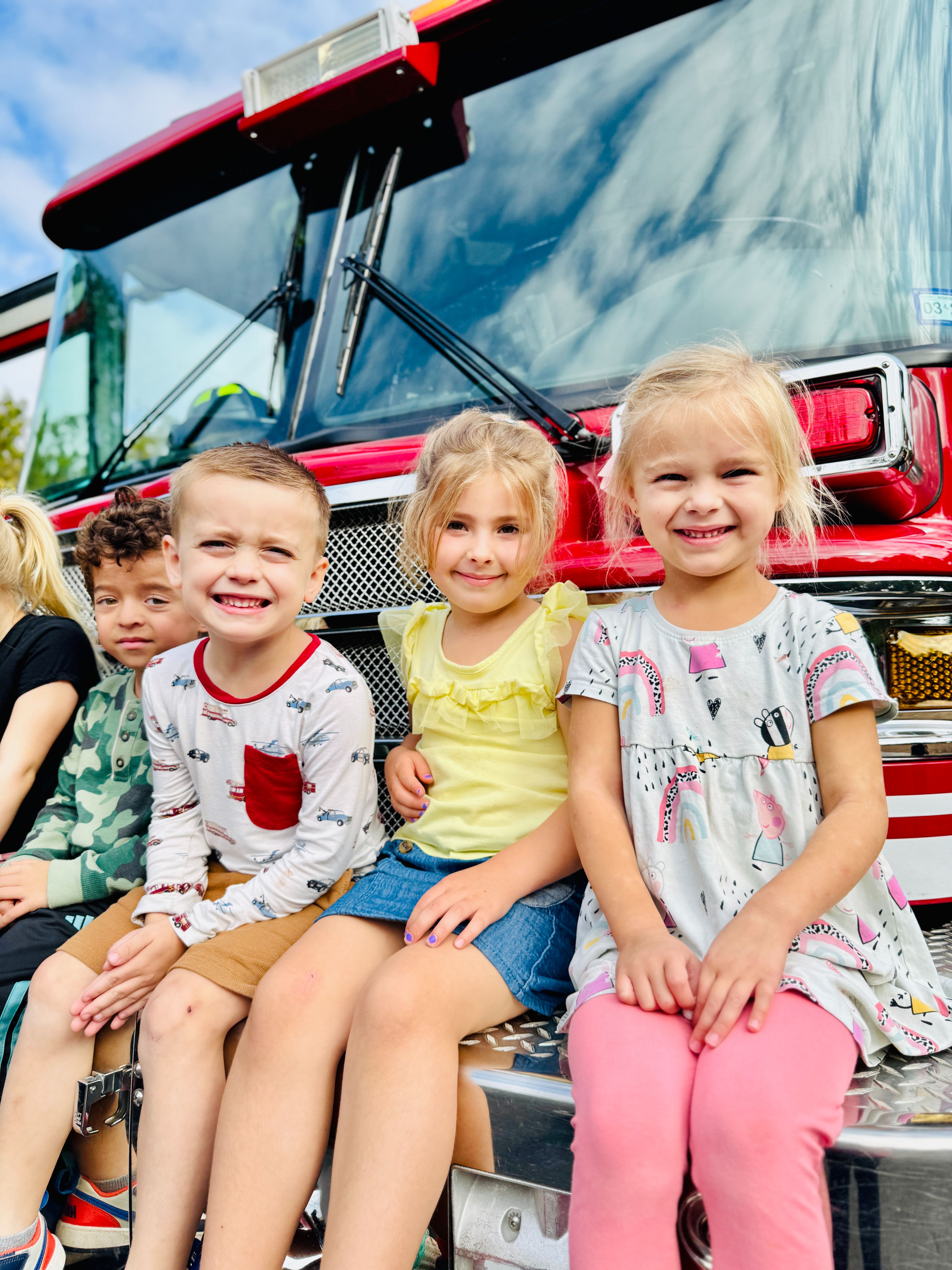 Preschool children at their in-school field trip visit by the local fire department.