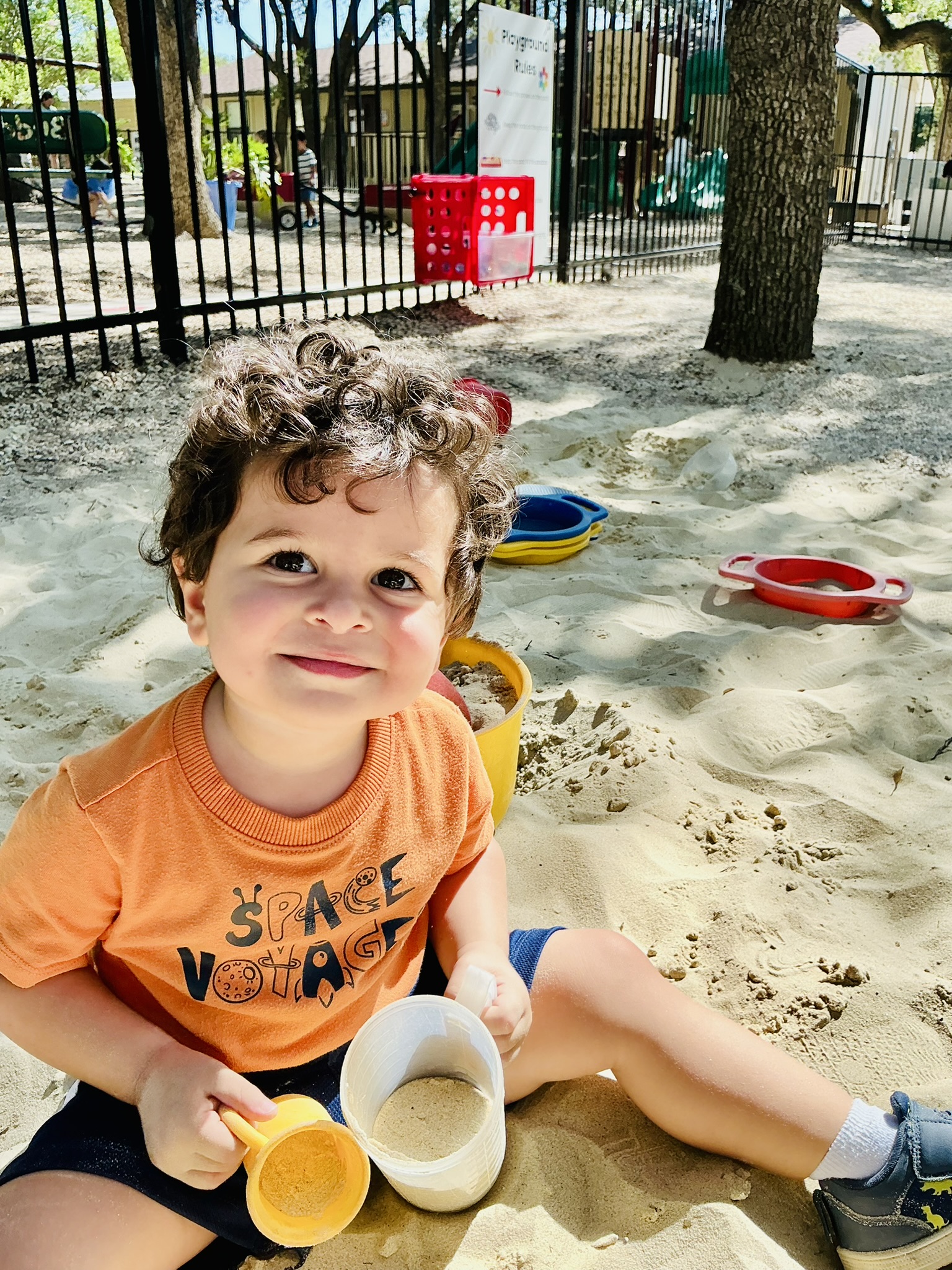 Toddler playing on the school playground.