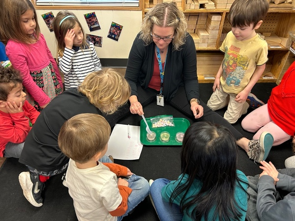 Preschool children doing science experiment.
