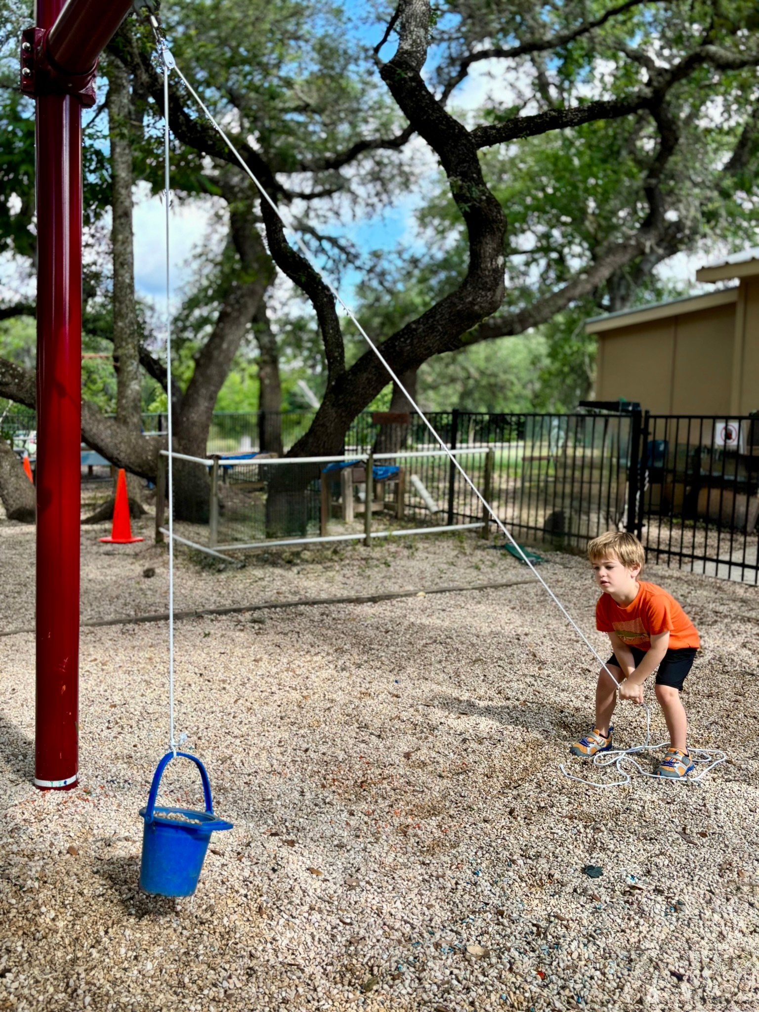 Preschool child doing an engineering activity at summer camp.