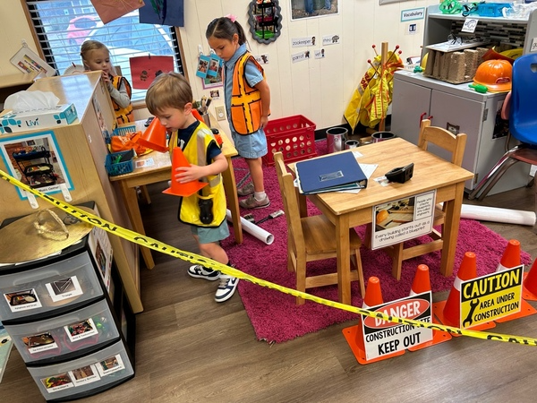 Children engaged in play in the preschool classroom.