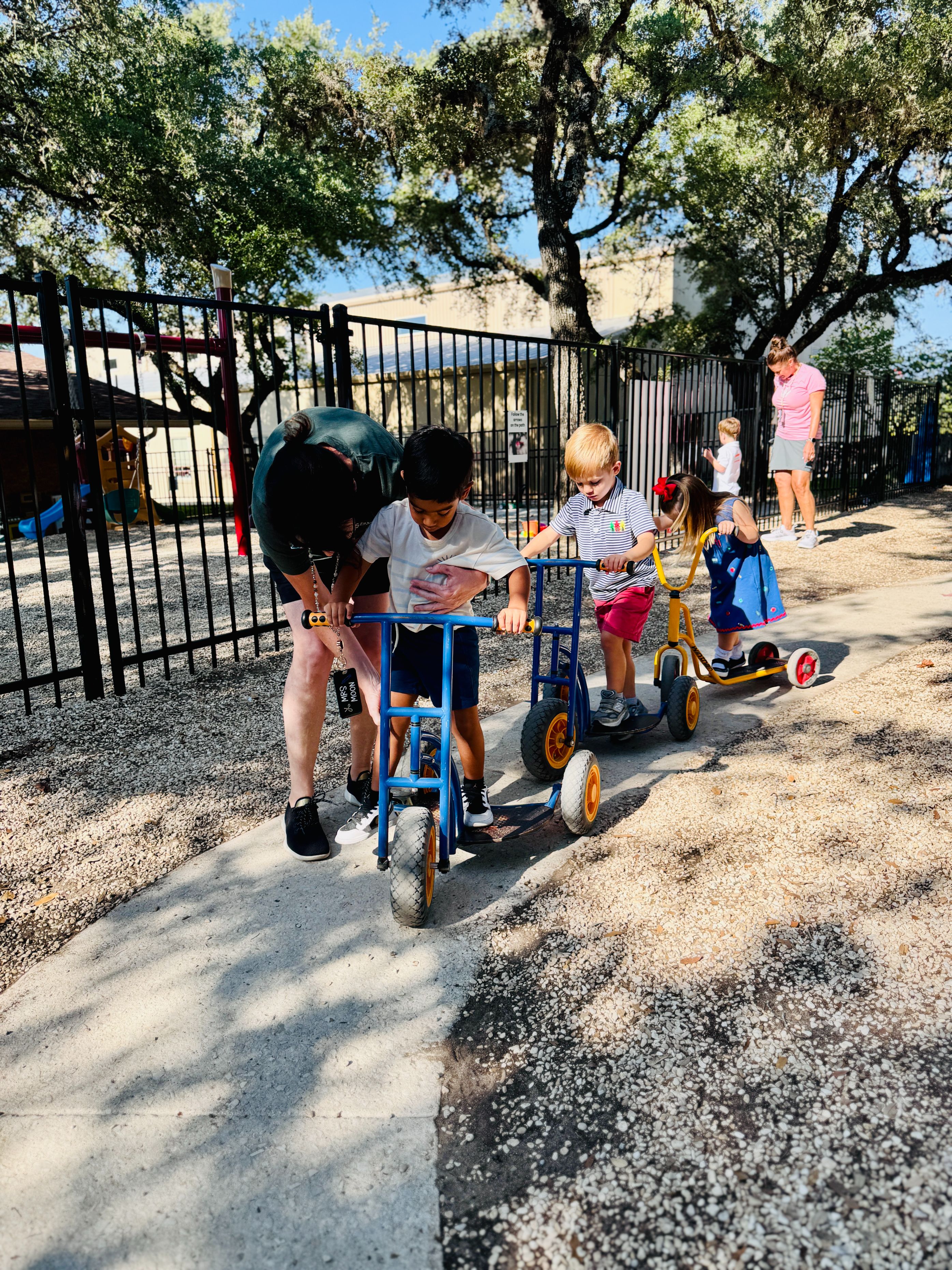 Children playing on the playground at preschool.