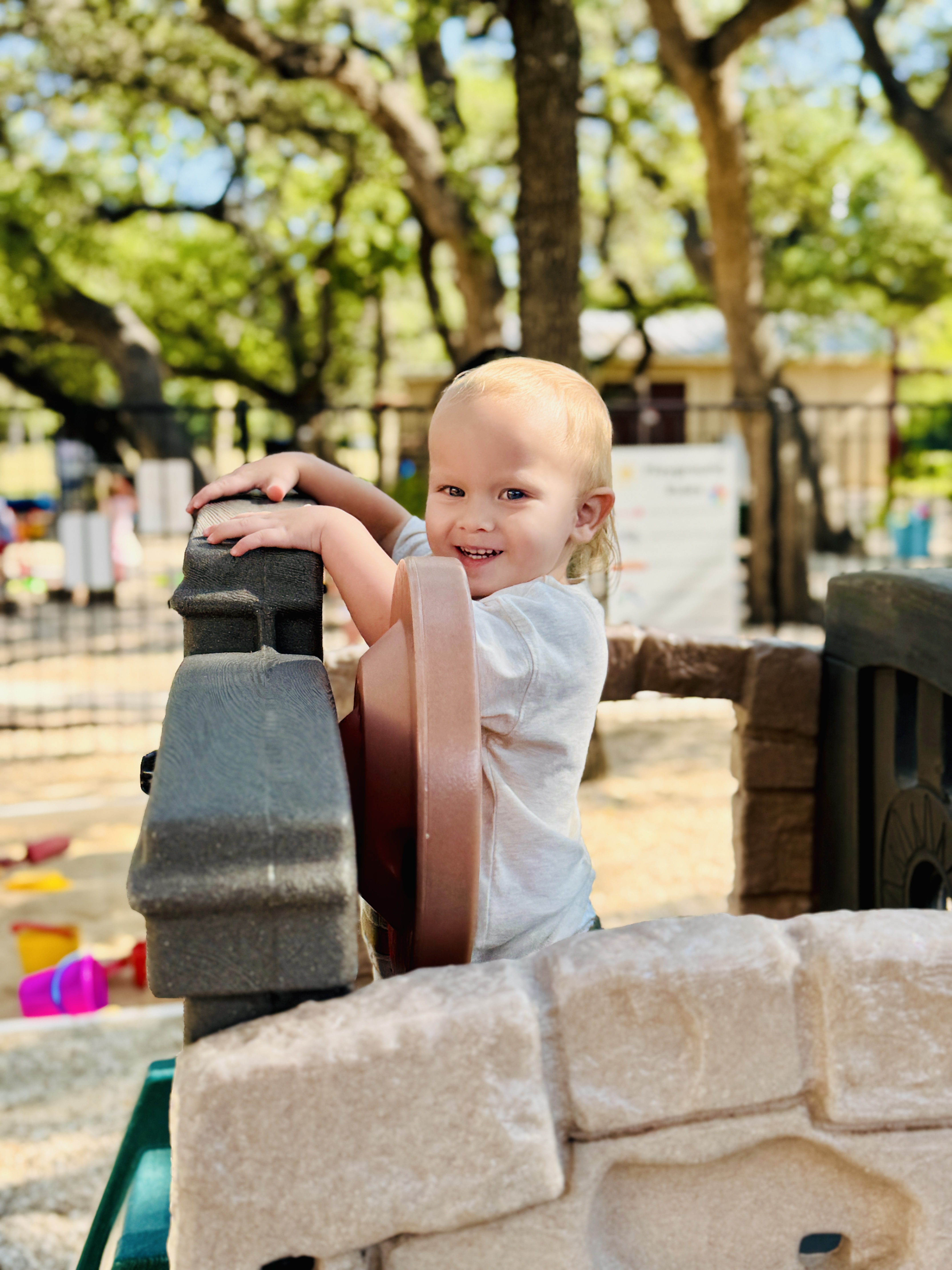 Toddler playing on the school playground.