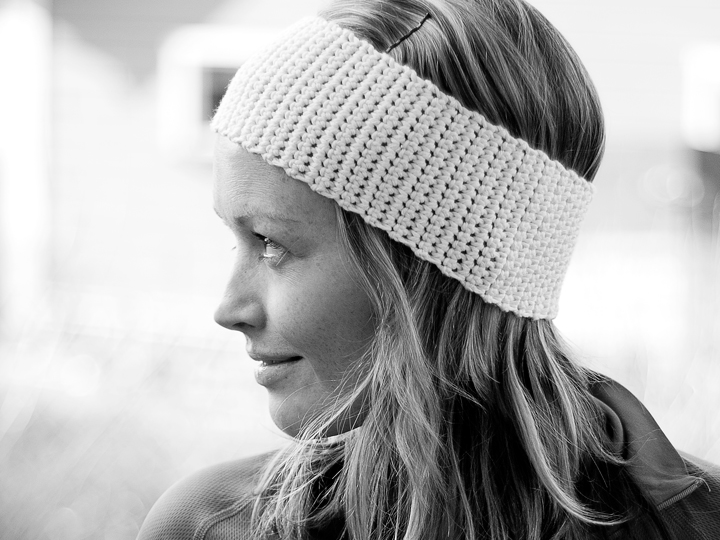 The designer wearing a white crocheted headband
